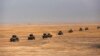 Iraq's elite counterterrorism forces prepare to attack Islamic State positions as fighting to retake the extremist-held city of Mosul enters its second week, in the village of Tob Zawa, outside Mosul, Oct. 24, 2016. 