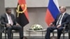 FILE - Angola's President Joao Lourenco, left, speaks to Russia's President Vladimir Putin at the BRICS summit in Johannesburg, South Africa, July 26, 2018. 