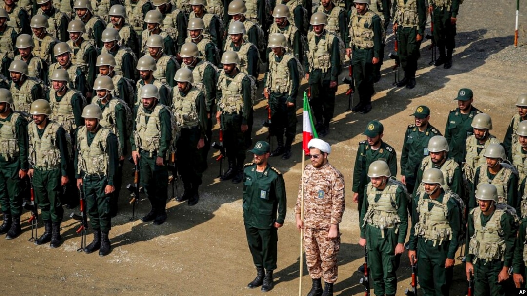 FILE - In this photo provided by the IRGC Ground Force on Oct. 17, 2022, troops stand while attending a maneuver in northwestern Iran. Iran's government is increasingly flexing its military muscle abroad, including the running of drills in a border region with Azerbaijan. 