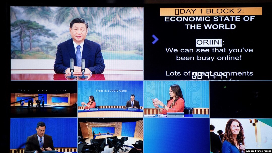 This handout picture taken and released on Nov. 11, 2021, by APEC New Zealand shows China's President Xi Jinping, top left, appearing on a screen via video link during the virtual business conference on the sidelines of the Asia-Pacific Economic Cooperati