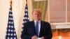U.S. President Donald Trump poses on the Truman Balcony of the White House after returning from being hospitalized at Walter Reed Medical Center for coronavirus disease (COVID-19) treatment, in Washington, Oct. 5, 2020. 