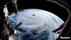Super Typhoon Trami is seen from the International Space Station as it moves in the direction of Japan, Sept. 25, 2018 in this image obtained from social media on Sept. 26, 2018. 