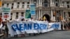 FILE - Climate change activists march during a protest in downtown Philadelphia ahead of the Democratic National Convention, July 24, 2016.