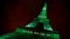 FILE - The Eiffel tower is illuminated in green with the words "Paris Agreement is Done," to celebrate the Paris U.N. Climate Change agreement in Paris, France, Nov. 4, 2016.