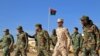 Fighters of a military battalion loyal to Libyan General Khalifa Haftar march during the morning assembly in the eastern city of Benghazi on Dec. 18, 2019. 
