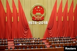 Chinese President Xi Jinping and others attend an event marking the 40th anniversary of China's reform and opening up at the Great Hall of the People in Beijing, China, Dec. 18, 2018.