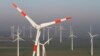 FILE - Wind turbines produce green energy.