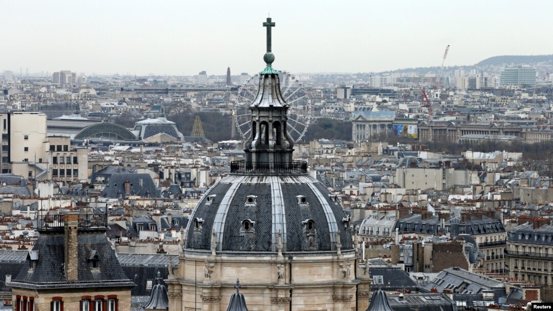 FILE- A city view shows the dome at La Sorbonne University as part of the skyline in Paris, France, March 30, 2016. 
