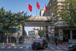 Chinese soldiers and security personnel secure the main entrance of the Jingxi Hotel, site of the Fourth Plenum of China's Communist Party Central Committee, in Beijing, Oct. 28, 2019.