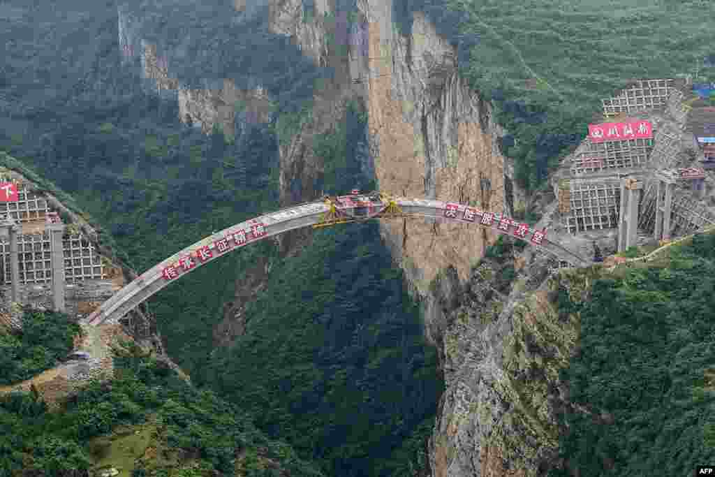 This photo taken on July 7, 2019 shows the main structure of the Jimingsansheng Bridge as it is joined together in Xuyong county in Luzhou City in China's southwestern Sichuan province.