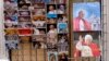 Postcards and calendars are displayed outside a shop at the Vatican, February 12, 2013.