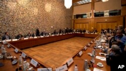 Representatives of Libya and the United Nations gather in Berlin, June 10, 2015.