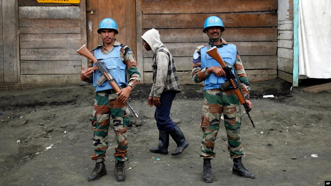 FILE - Two MONUSCO UN soldiers stand guard in Goma's port.