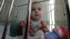 US Hopeful Pending Russian Adoptions Can Continue