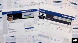 FILE - A new report says the Islamic State group finds ways to avoid detection on social media platforms such as Facebook.