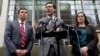 Attorney General Bob Ferguson, center, stands with Solicitor General Noah Purcell, left, and Civil Rights Unit Chief Colleen Melody as he speaks with media members on the steps of the federal courthouse after an immigration hearing there, March 15, 2017, 