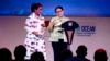 Indonesian Minister of Foreign Affairs Retno Marsudi, right, stands with Indonesian Minister of Marine Affairs and Fisheries Susi Pudjiastuti while speaking during the opening of the Our Ocean Conference in Bali, Indonesia, Oct. 29, 2018.