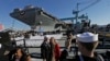 U.S. Navy Bosons mate, Ben Hansen and his wife Jessica, of Edmore Mich., photographed in front of the Navy's newest nuclear powered aircraft carrier, the USS Gerald R. Ford, Newport News Shipbuilding, Newport News, Va., Nov. 9, 2013.