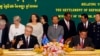 FILE - Australian Immigration Minister Scott Morrison, front left, signs a document together with Cambodian Interior Minister Sar Kheng, front right, during a signing ceremony of a controversial deal on resettlement of refugees inside the Interior Ministry in Phnom Penh, Cambodia, Friday, Sept. 26, 2014. 