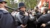 Police officers scuffle with demonstrators during a protest in support of Islamist cleric Abu Hamza al-Masri, during his appeal against extradition to the U.S., outside the High Court in London, October 5, 2012.
