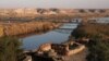 FILE - A Turkish army tank is positioned at a military post by the Euphrates river on the Turkish-Syrian border, in Karkamis, Gaziantep province, Turkey, Dec. 13, 2017. 
