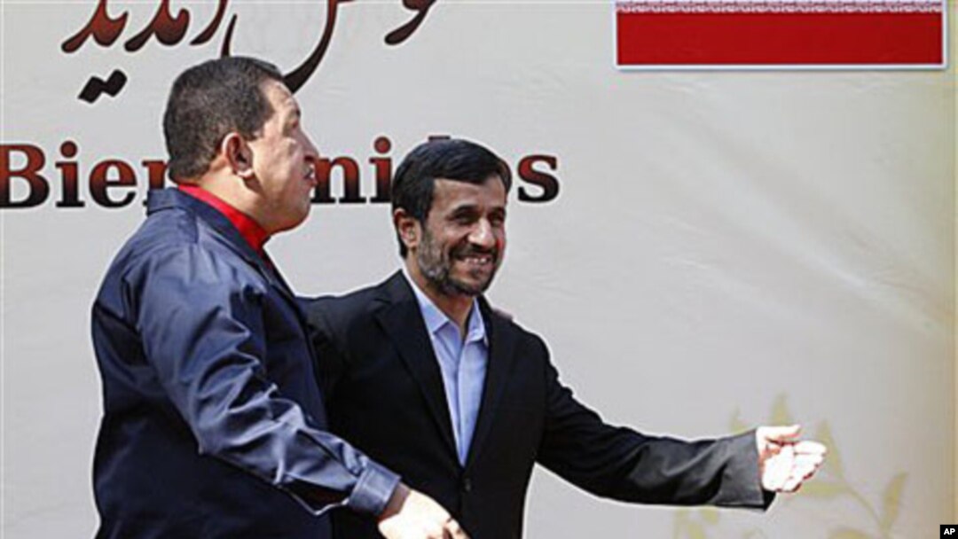 Iranian President Mahmoud Ahmadinejad, center, welcomes his Venezuelan counterpart Hugo Chavez, during an official welcoming ceremony, in Tehran, Iran, 19 Oct 2010