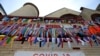 FILE - Ribbons hang in remembrance of victims of the coronavirus pandemic outside the Grant African Methodist Episcopal Church, May 19, 2020, in Boston.
