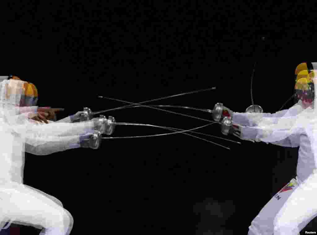 Venezuela's Ruben Limardo competes against his brother Jesus Limardo during the Fencing Men's Epee Individual Gold Medal Bout at the Lima 2019 Pan-American Games in Lima, Peru, Aug. 5, 2019.