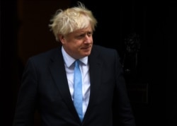 FILE - Britain's Prime Minister Boris Johnson walks out 10 Downing Street, in London, Britain, Sept. 5, 2019.