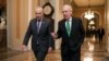Senate Majority Leader Mitch McConnell, R-Ky., and Senate Minority Leader Chuck Schumer, D-N.Y., left, walk to the chamber after collaborating on an agreement on a two-year, nearly $400 billion budget deal that would provide Pentagon and domestic programs