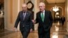 FILE - Senate Republican Majority Leader Mitch McConnell, and Senate Democratic Minority Leader Chuck Schumer left, walk toward the Senate chamber at the U.S. Capitol, in Washington, Feb. 7, 2018.