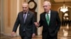 Senate Majority Leader Mitch McConnell, R-Kentucky, right, and Senate Minority Leader Chuck Schumer, D-New York, walk to the chamber after collaborating on a budget deal at the Capitol, in Washington, Feb. 7, 2018.