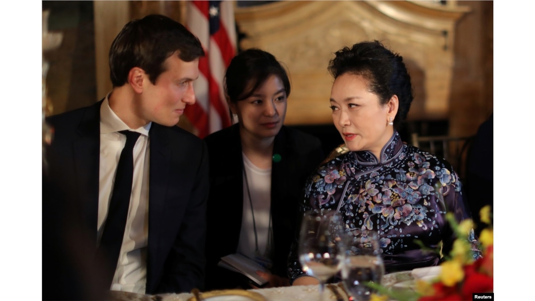 FILE - China's first lady Peng Liyuan talks with Trump Senior Adviser Jared Kushner as they attend a dinner at the start of a summit between U.S. President Donald Trump and Chinese President Xi Jinping at Trump's Mar-a-Lago estate in West Palm Beach, Florida.