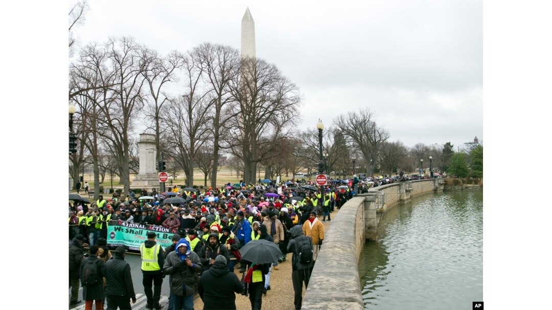 Civil rights advocates march to honor the Rev. Martin Luther King Jr. in Washington, D.C., Jan. 14, 2017.