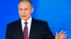 Russian President Vladimir Putin gestures as he gives his annual state of the nation address in Manezh in Moscow, Russia, March 1, 2018.