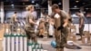 FILE - This March 30, 2020, photo provided by the Illinois Air National Guard shows members of the Guard assembling medical equipment in response to the COVID-19 coronavirus pandemic in Chicago.