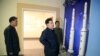 김정은(가운데) 북한 국무위원장이 국가우주개발국 위성관제종합지휘소를 방문하고 있다. (자료사진)