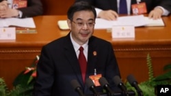 中國最高法院院長周強在人大會議上作最高人民法院政府工作報告。