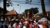 FILE - Protesters gather in front of the Appeals Court during a protest near the Royal Palace in central Phnom Penh, February 10, 2014.