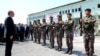 Turkey President Recep Tayyip Erdogan, left, reviews officers of the special police forces, at their headquarters in Ankara, Turkey, Friday, July 29, 2016.