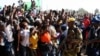 Supporters of Zimbabwean President Robert Mugabe's ZANU-PF party cheer during an election rally in Chitungwiza, about 35 kilometers south of the capital Harare, July 16, 2013.