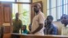 Pastor Paul Mackenzie Nthenge, who was arrested on suspicion of telling his followers to fast to death in order to meet Jesus, accompanied by some of his followers, appears at a court in Malindi, Kenya on April 17, 2023. 