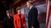 Sen. Jeanne Shaheen, D-N.H., center, and Sen. Joni Ernst, R-Iowa, left, talk with Sen. Thom Tillis, R-N.C., right, on Capitol Hill in Washington, Feb. 7, 2018,