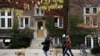 People walk their dogs on the campus of the University of Wisconsin-Madison as the coronavirus disease (COVID-19) outbreak continues in Madison