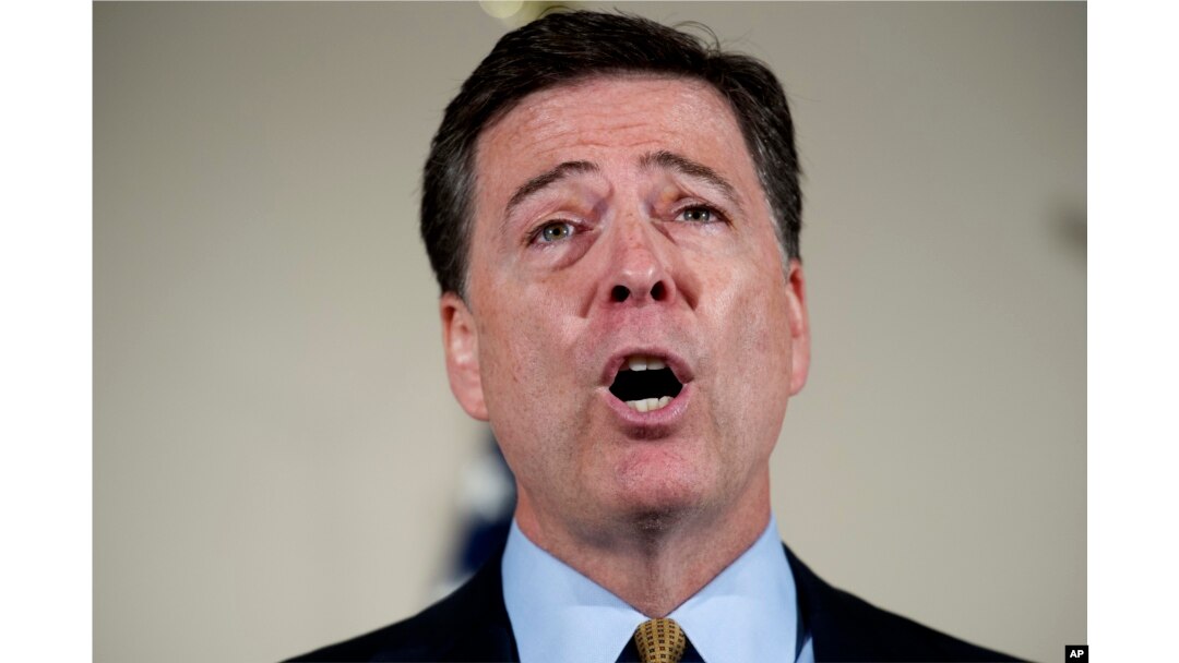 FILE - FBI Director James Comey makes a statement at FBI Headquarters in Washington regarding its investigation into Hillary Clinton's use of a private email server while secretary of state.