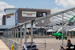 Temporary structures go up outside the Wells Fargo Center ahead of the 2016 Democratic National Convention in Philadelphia, June 20, 2016.