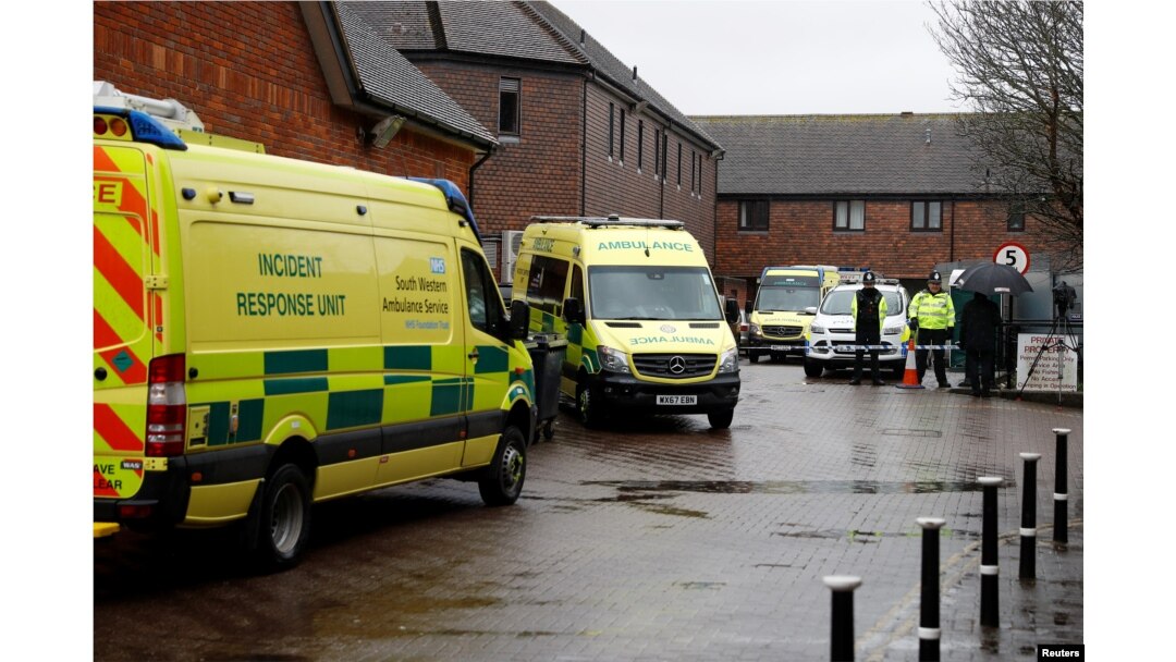Emergency services vehicles are parked behind a pub that was visited by former Russian intelligence officer Sergei Skripal and his daughter Yulia before they found poisoned, in Salisbury, Britain, March 28, 2018.