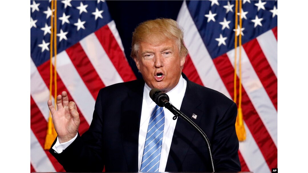FILE - Then-presidential candidate Donald Trump speaks during a campaign rally at the Phoenix Convention Center in Phoenix, Aug. 31, 2016.