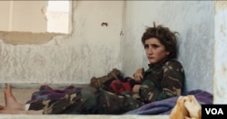 Osama, 13, wears a military uniform in a youth training camp run by former al-Qaida-affiliated group al-Nusra Front. (Kahtan Hasson for VOA)
