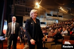 Marine Le Pen, National Front political party leader, attends a news conference, during the party's convention in Lille, France, March 10, 2018.